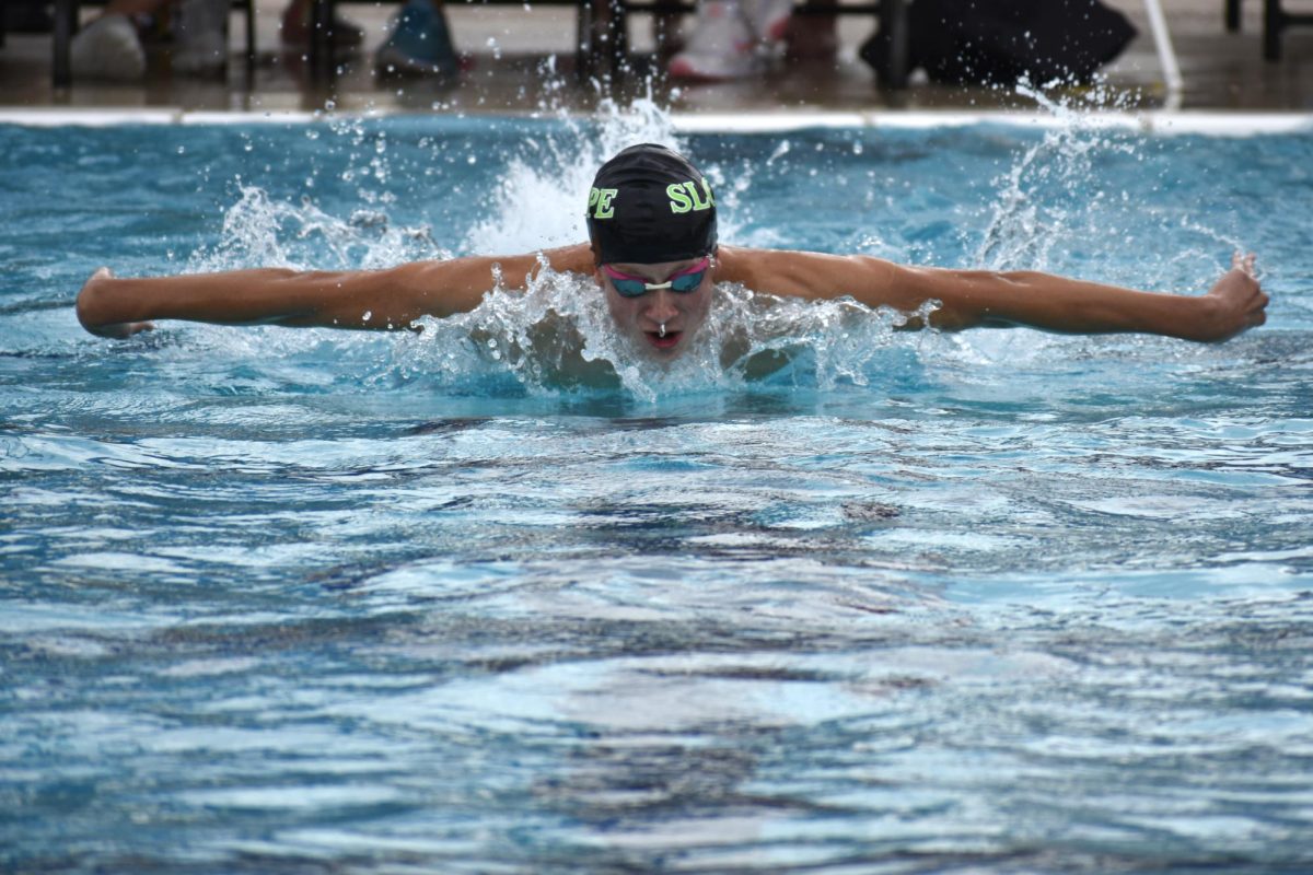 Senior Gavin Eagar takes a breath on his way towards a personal best time in the Butterfly.